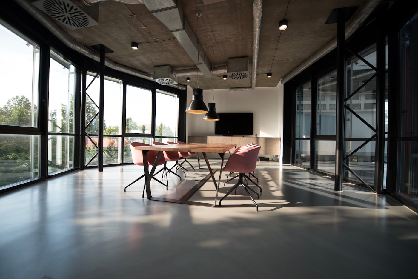 Empty boardroom with red chairs in a modern financial office