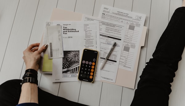Calculator and printed figures used for corporate data checks